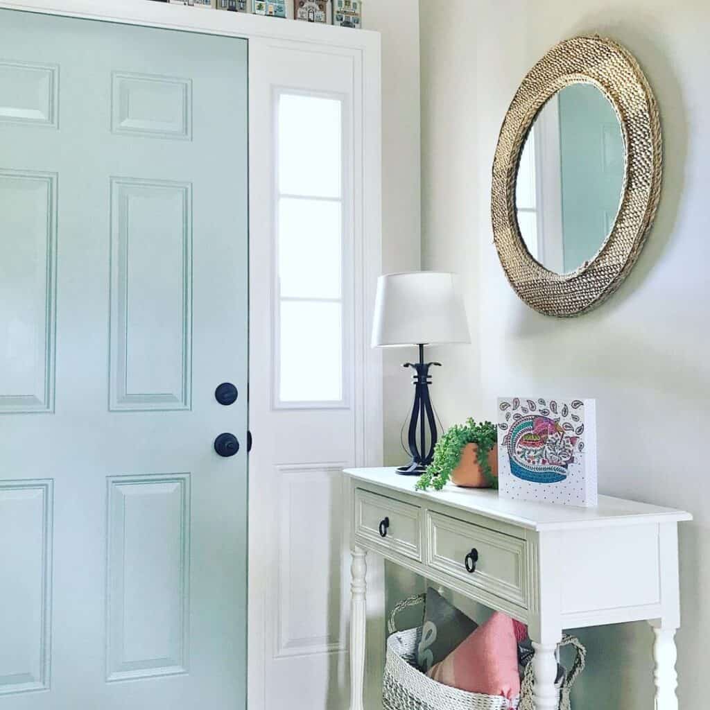 Light Blue Front Door With a Sidelight and Black Hardware