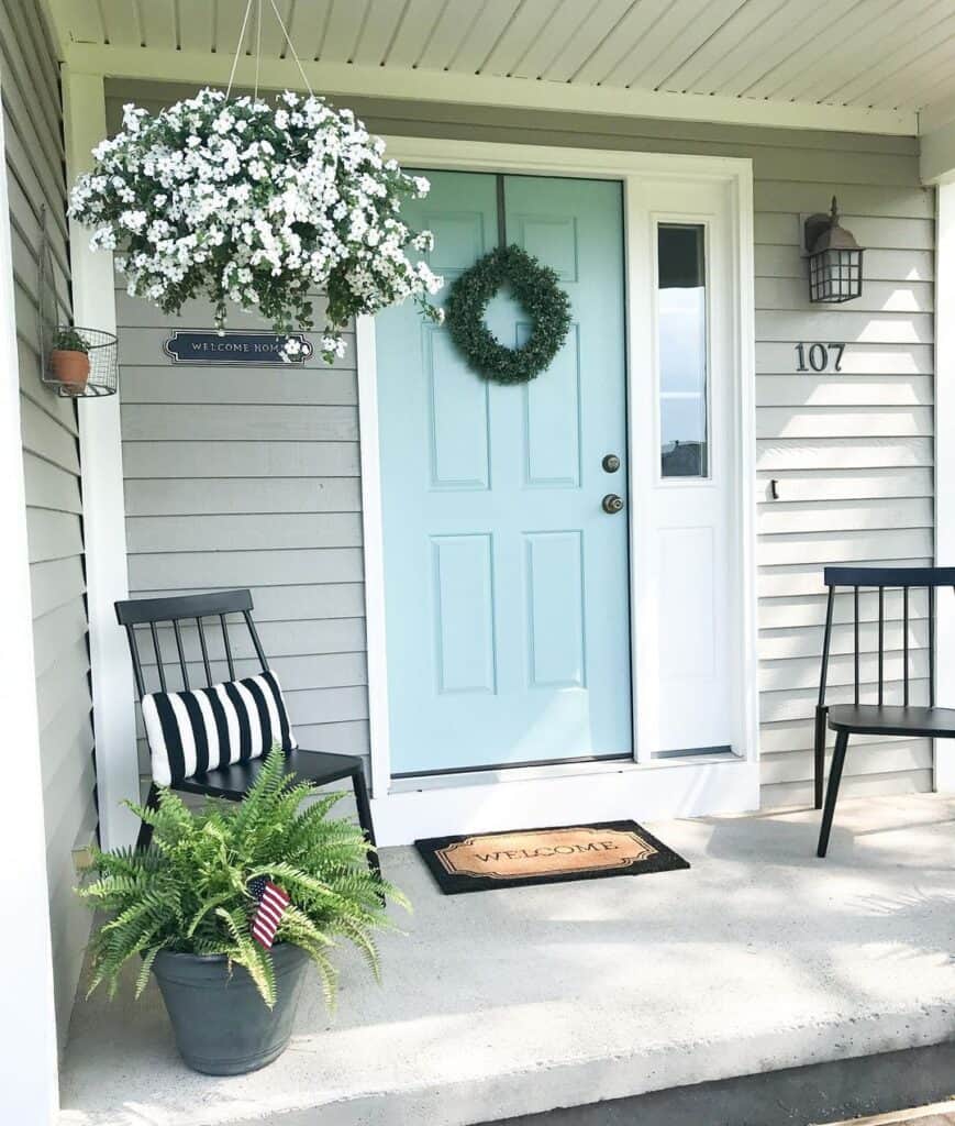 Light Blue Front Door With a White Sidelight