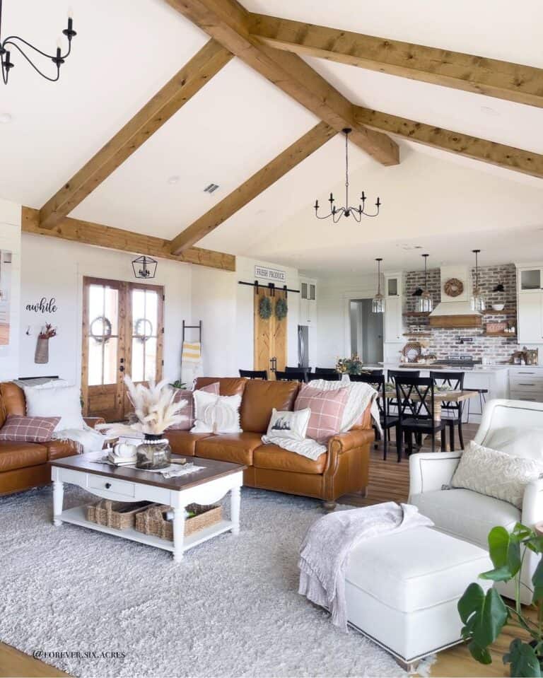 Light Brown Sofas Under Wood Ceiling Beams