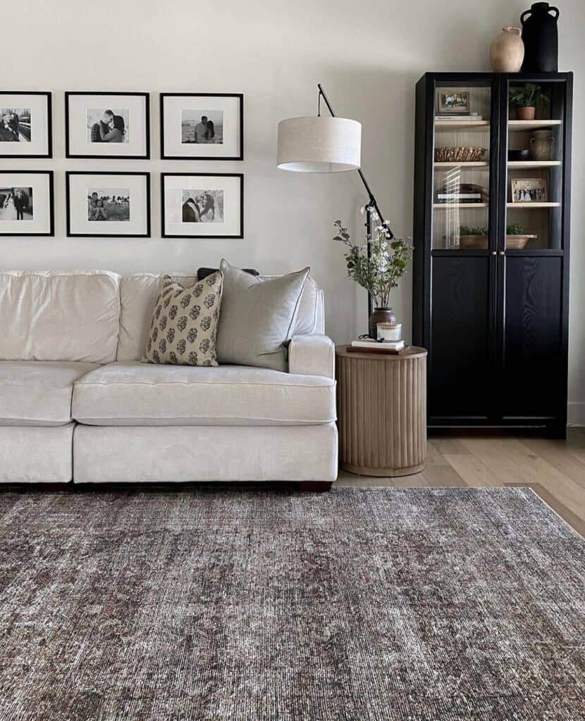 Living Room with Black Hutch and Cream Sofa