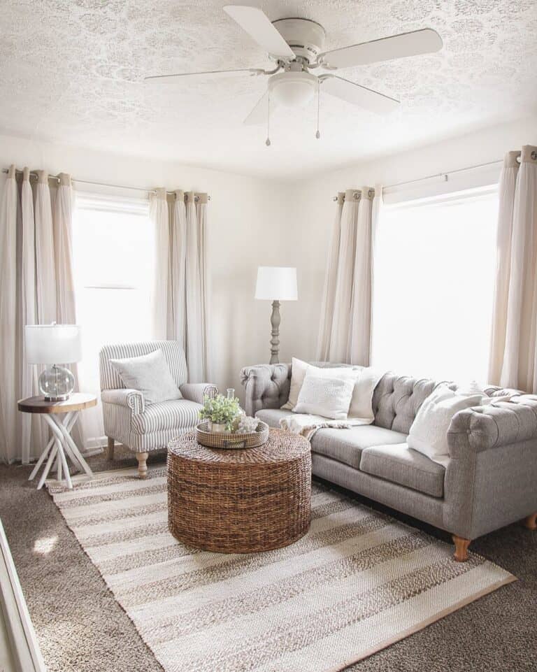 Living Room with Wicker Coffee Table and Gray Tufted Sofa