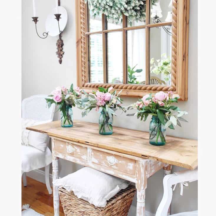 Mirrored Wooden Window Frame Decor Above Pink Bouquets