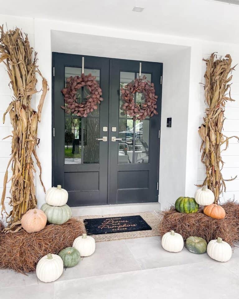 Modern Black Front Doors with Strawbale Decor