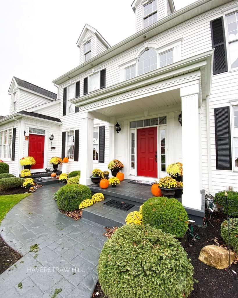 Modern Red Front Doors and White Siding