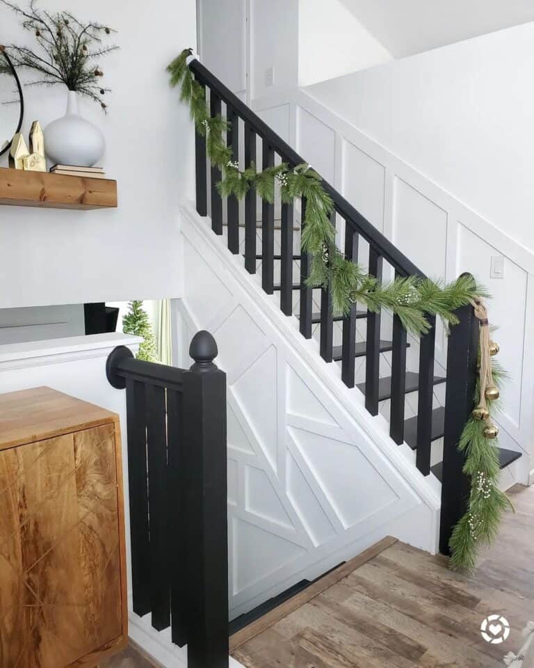 Modern White Stairs with Black Banister and Festive Touches