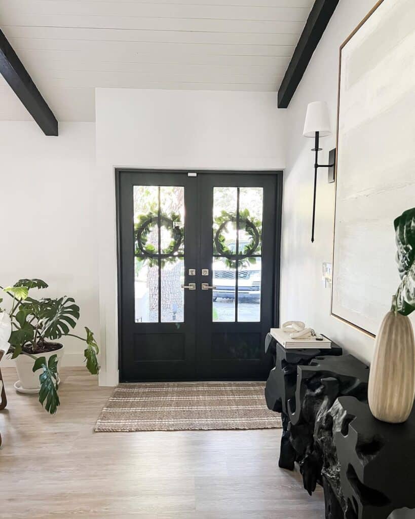 Monochrome Entryway with Foliage Accents