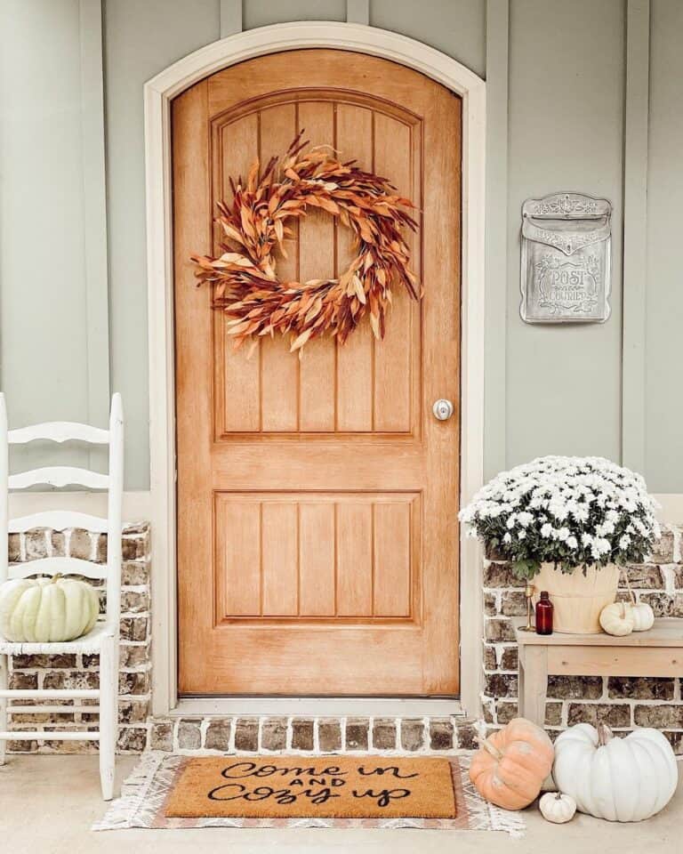 Natural Wood Front Door with Dried Leaf Wreath