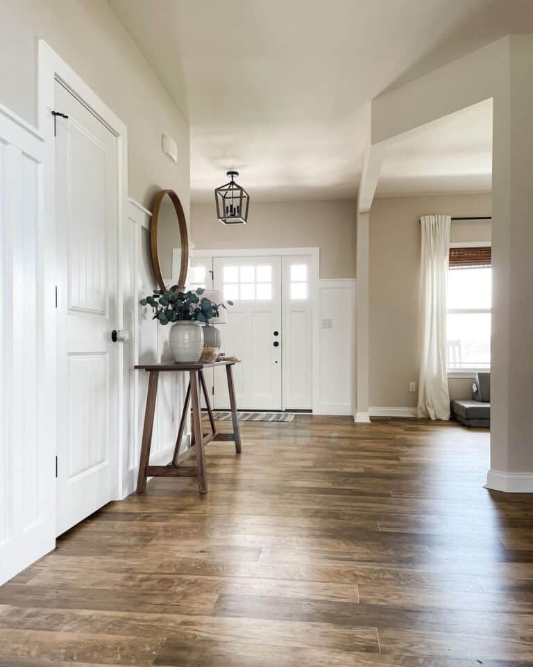 Neutral Entryway with Circular Mirror