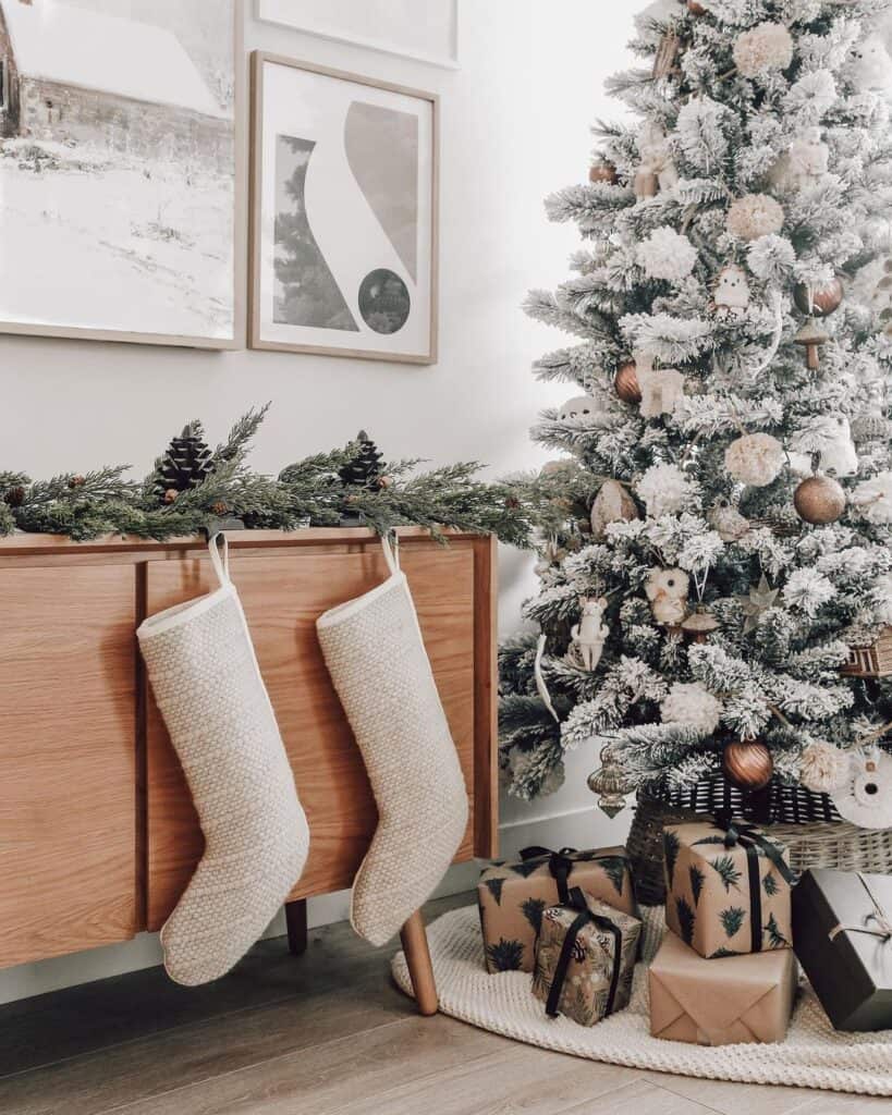 Neutral Stockings Next to Frosted Tree