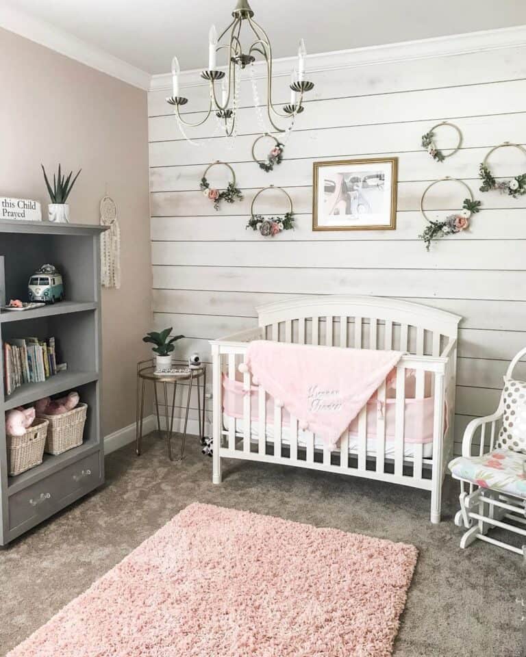 Nursery with Shiplap Wall and Pink Touches
