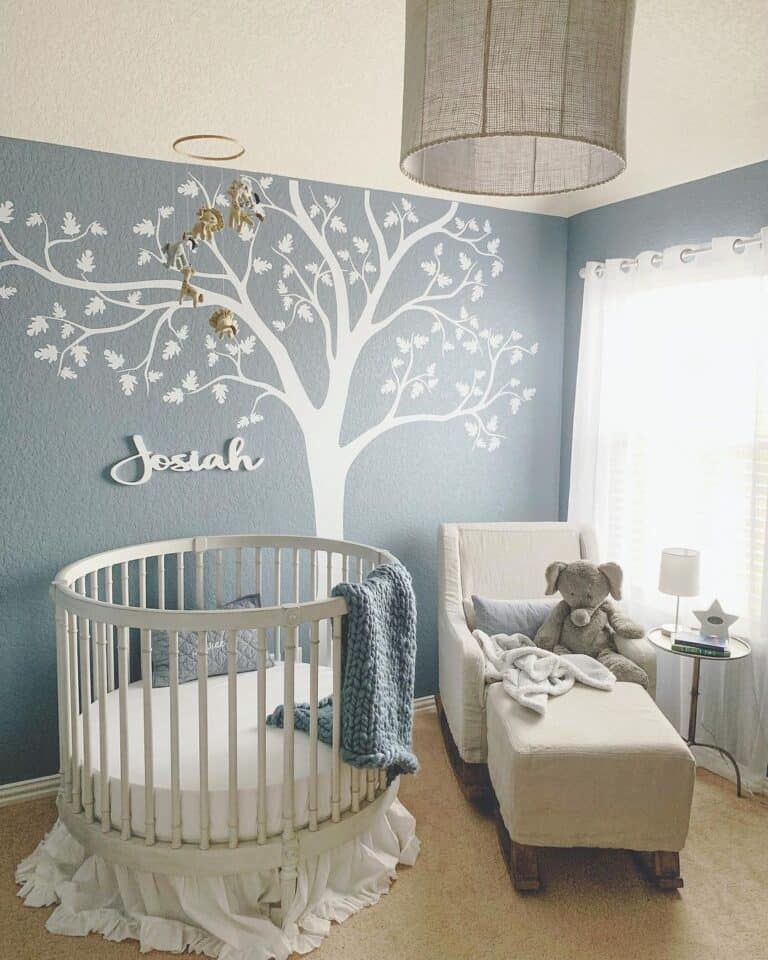 Nursery with Tree Mural and Circular Crib
