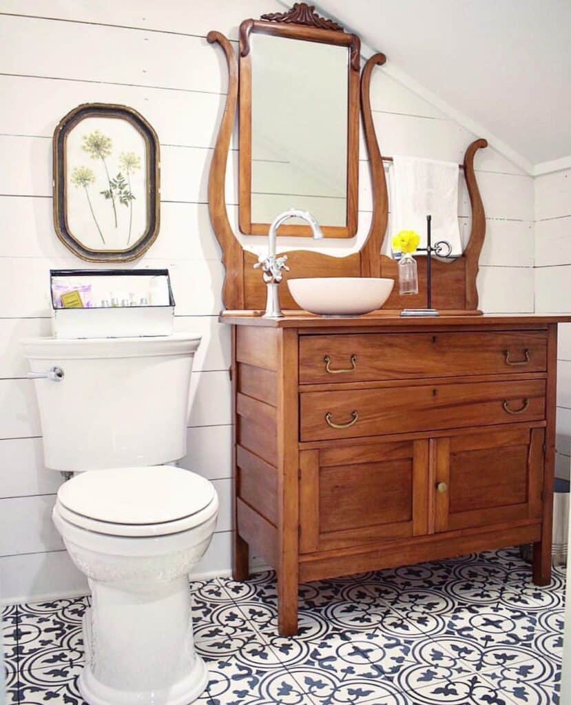 Old Vanity on Black and White Tile Floor in a Bathroom