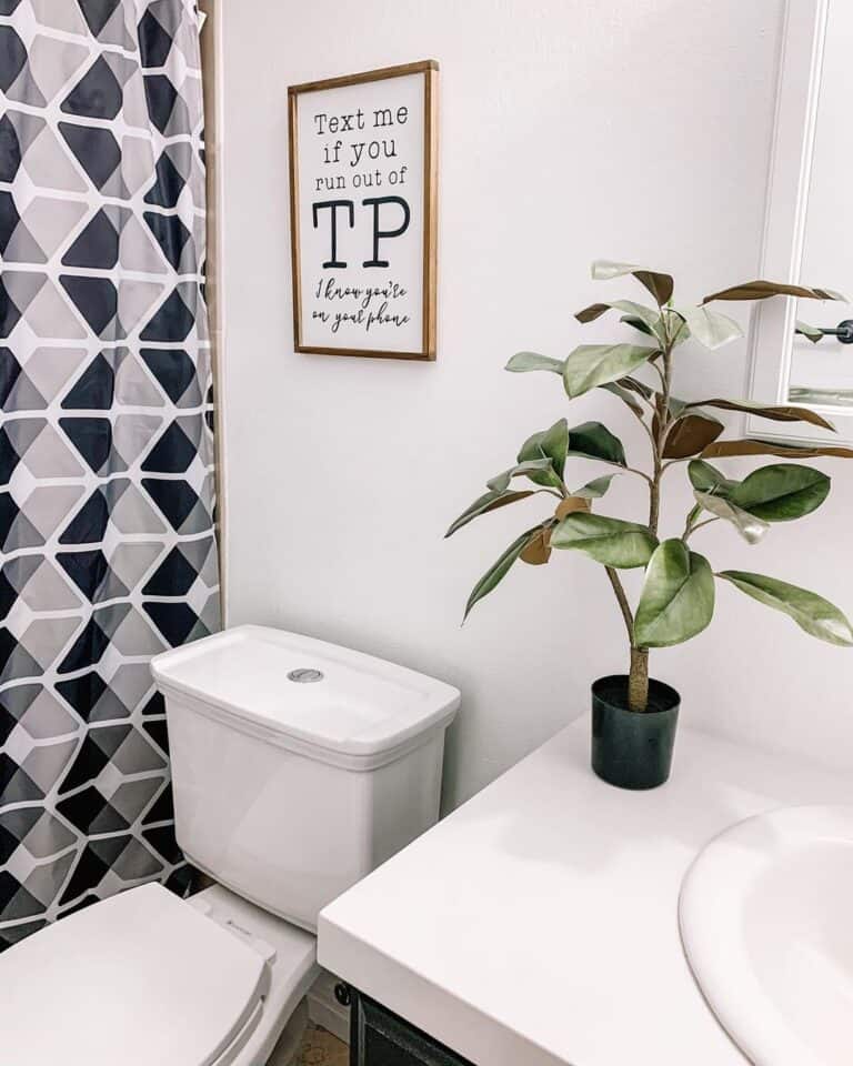 Patterned Shower Curtain and Wood Bathroom Sign