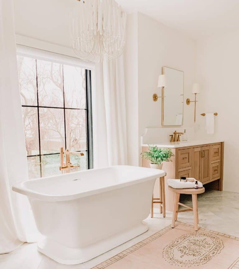 Pedestal Tub and White Bathroom Curtain