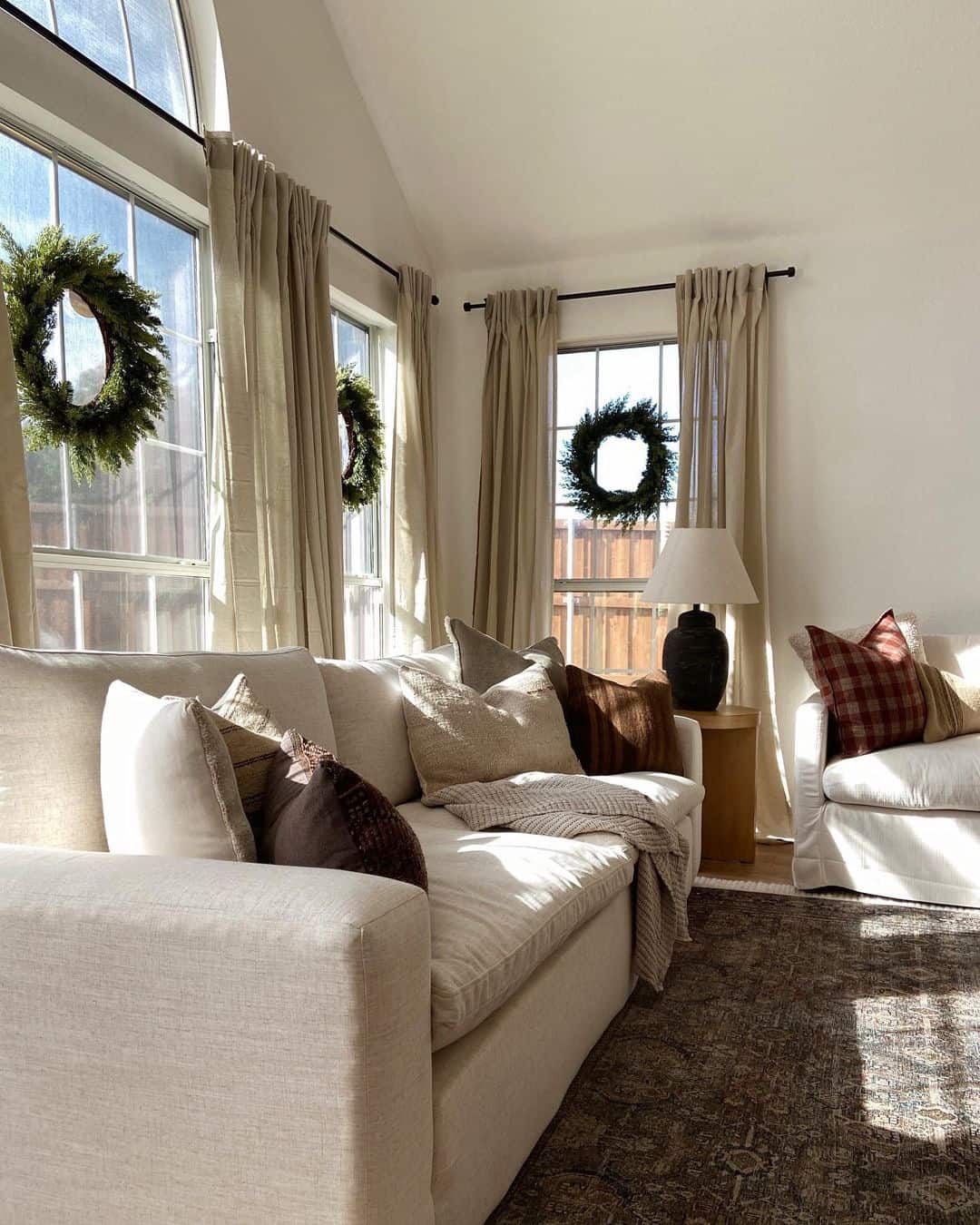 Pine Wreaths in Vaulted Ceiling Living Room - Soul & Lane