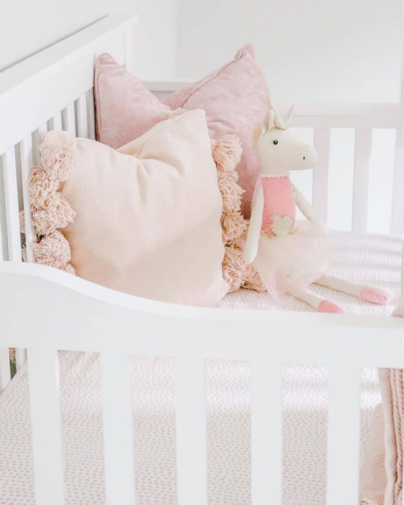 Pink Cushions in Girl's Crib