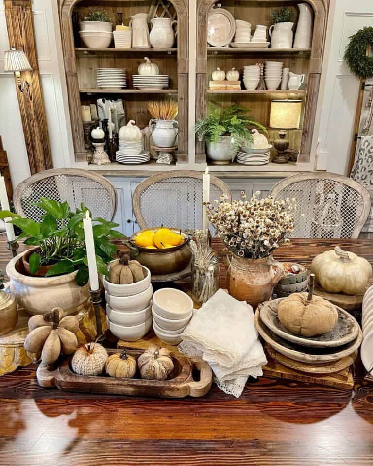 Polished Wood Table with Tan Pumpkins and Wooden Bowls Decor