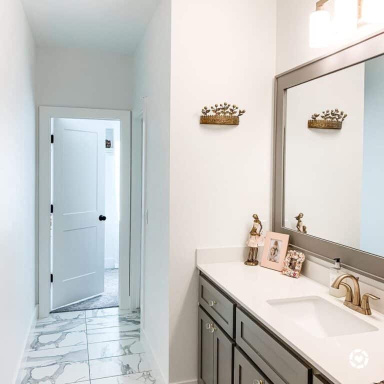 Rectangular Mirror Above Pink Bathroom Accessories