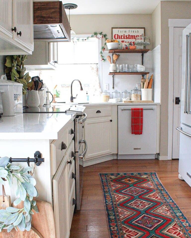 Red Decor Among White Cabinets