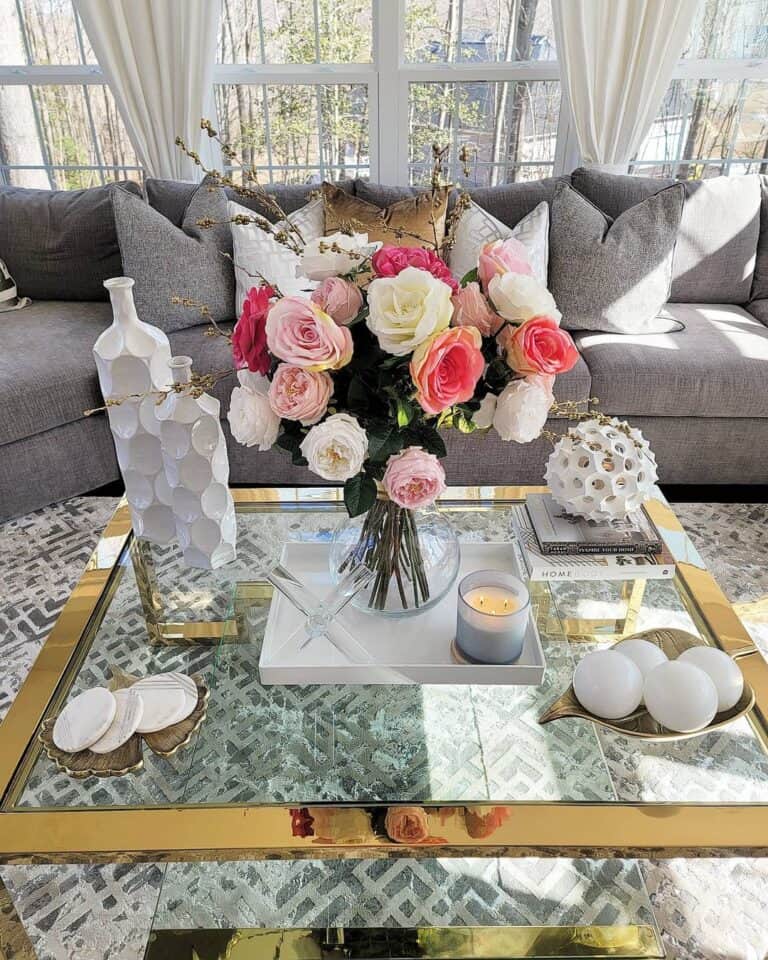 Roses on a Gold and Glass Coffee Table