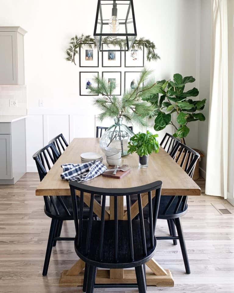 Rustic Black Dining Chairs in a Room Filled With Plants