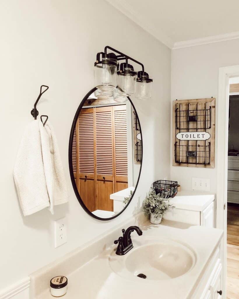 Rustic Elements with a Circular Mirror Bathroom