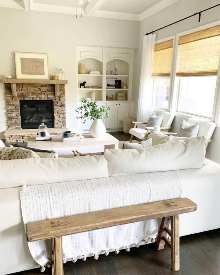 Stacked Stone Fireplace Beside Shelving Unit