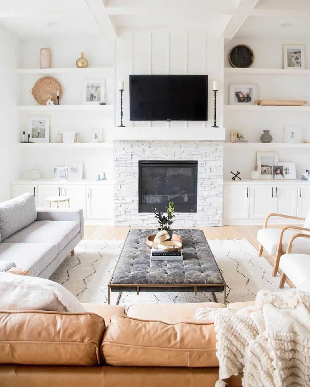 Stacked Stone Fireplace and Tufted Gray Ottoman Soul & Lane