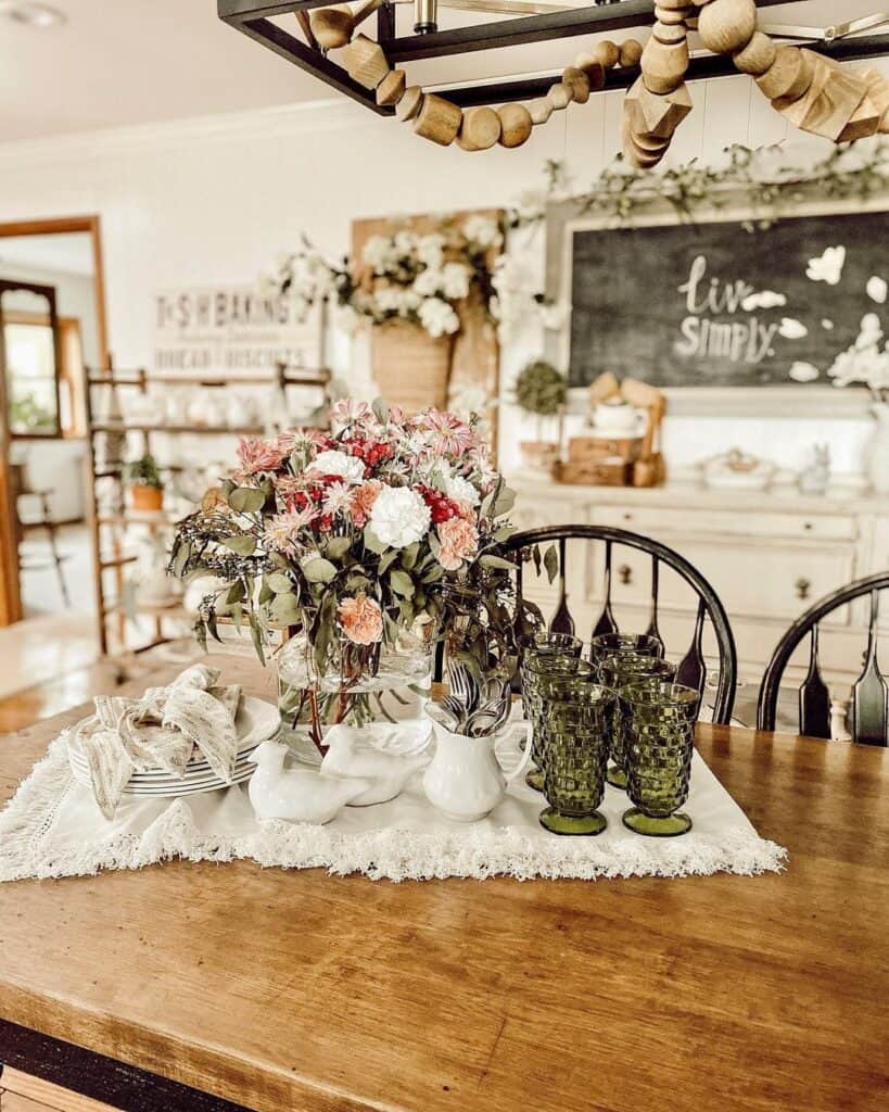 Table Centerpiece with Flowers and Fringed Cloth
