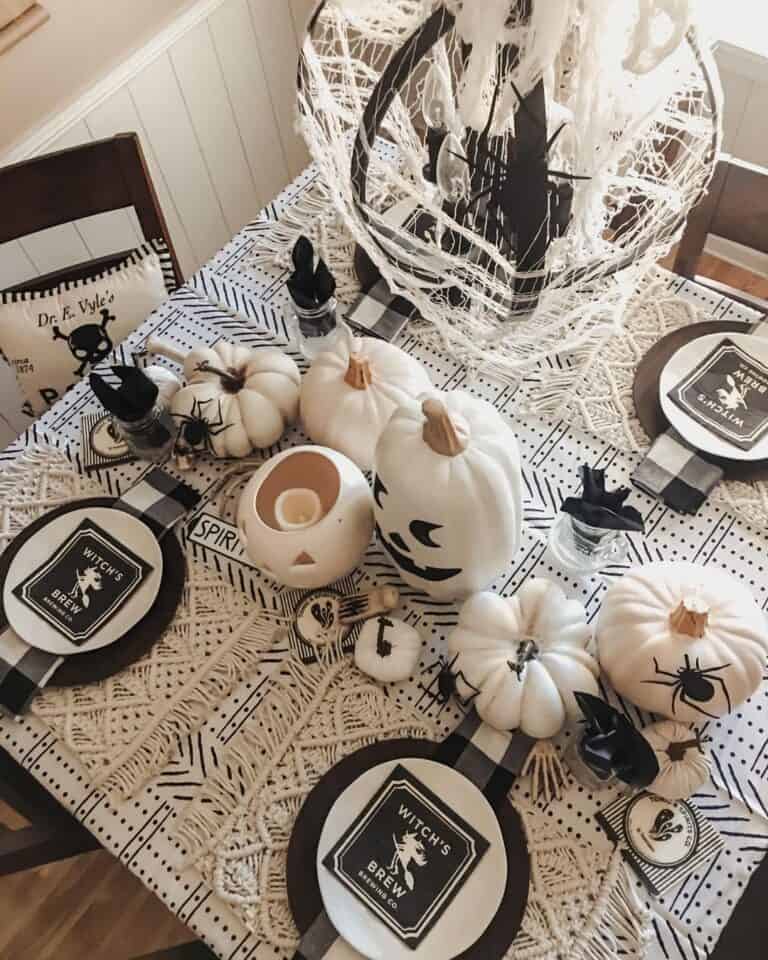 Table With Black and White Halloween Decorations