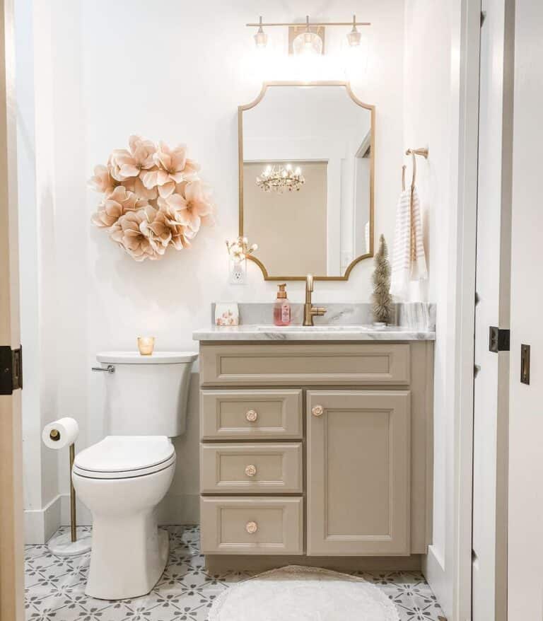 Taupe Vanity Complimented by Pink Bathroom Accessories