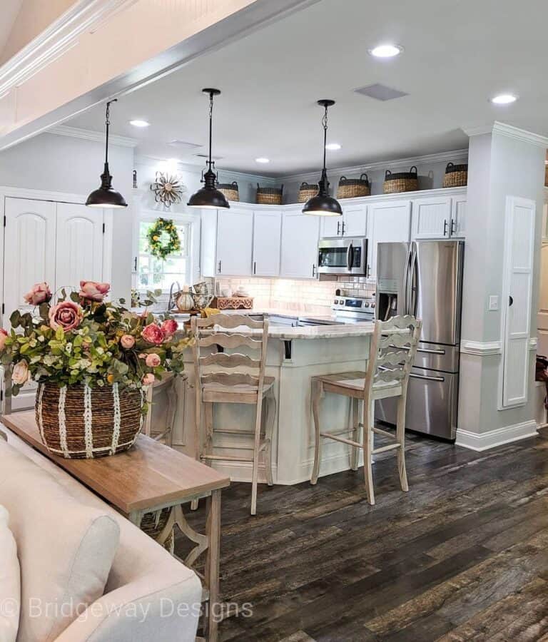 Three Hanging Black Lamps over a Kitchen Island