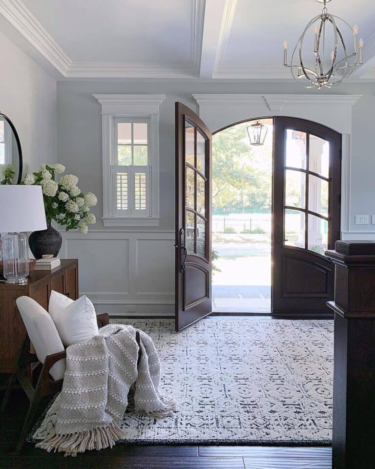 Traditional White Entryway with Dark Brown Accents