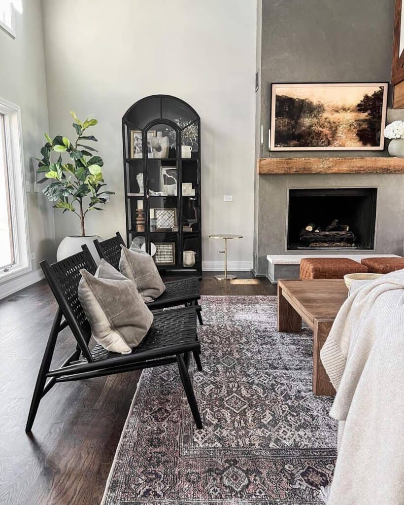 Two Brown Poufs and a Dark Grey Fireplace