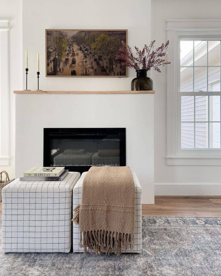 Two White Poufs and a White Fireplace