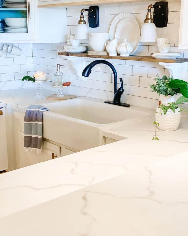 White Apron Sink with Black Faucet