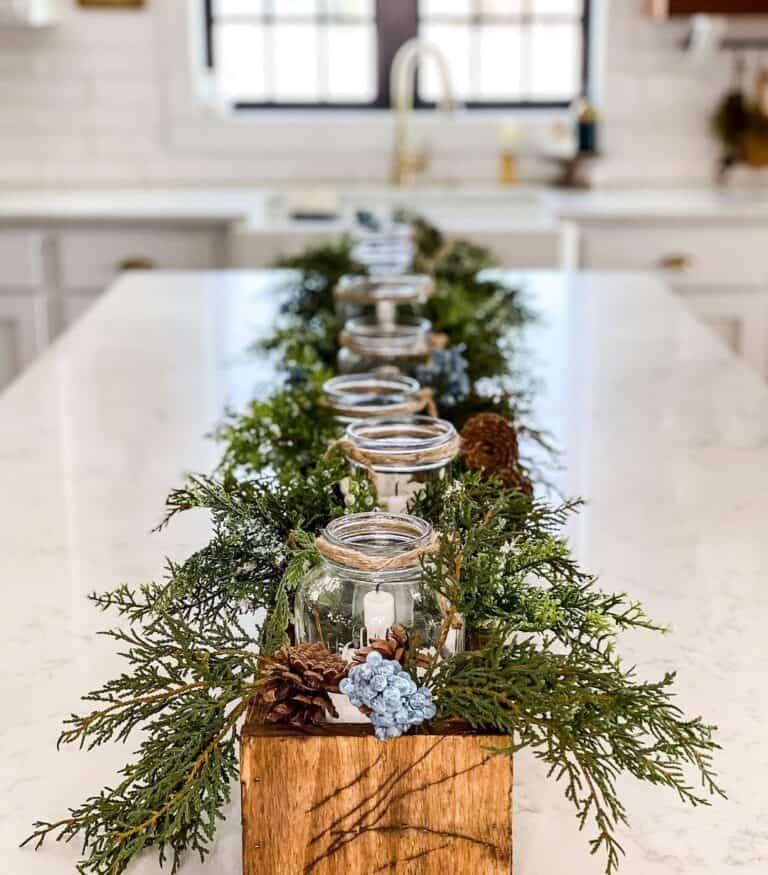 White Candles in Canning Jars in a Long Wooden Box