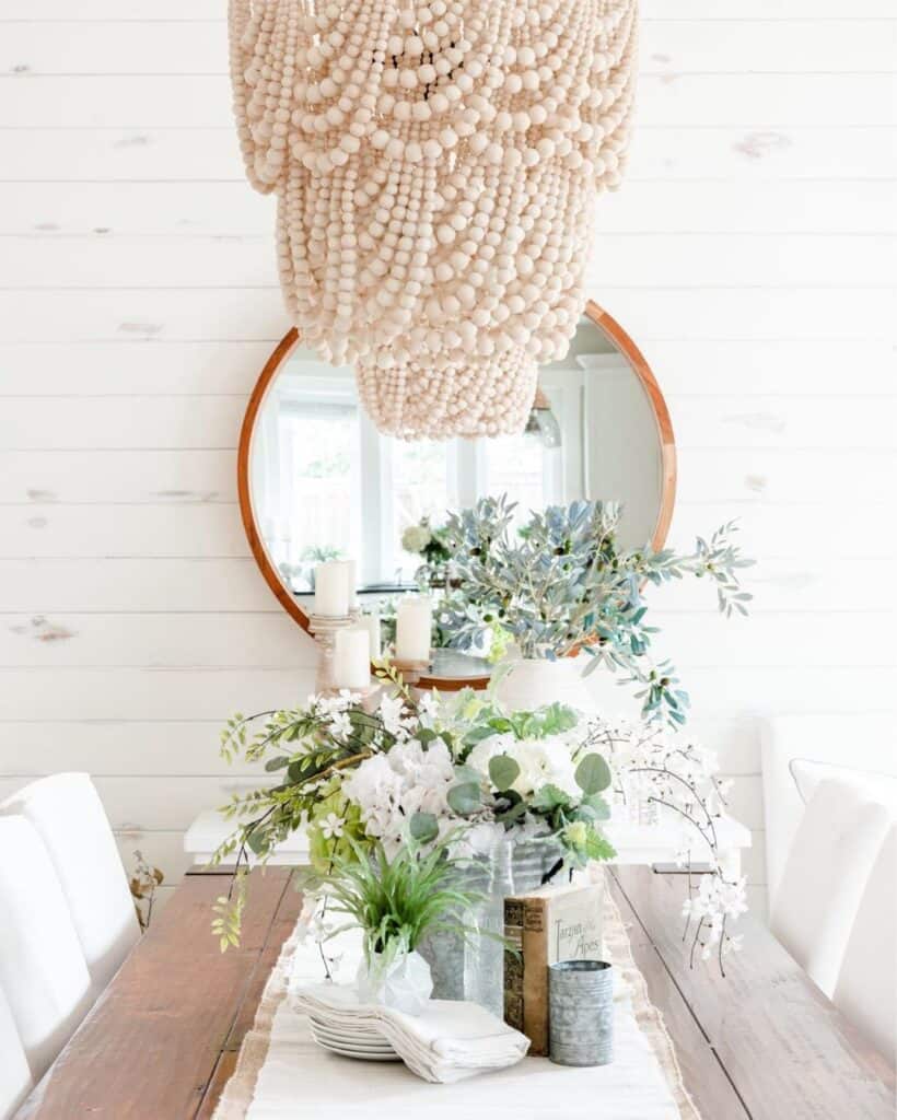 White Chandelier Over a Rustic Table