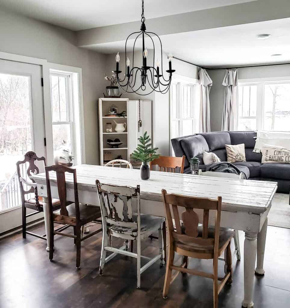 White Dining Table with Mismatched Chairs