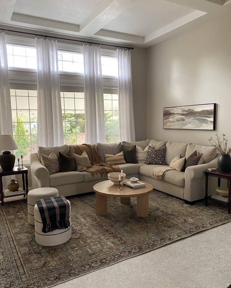 White Drapes Surround Living Room Windows