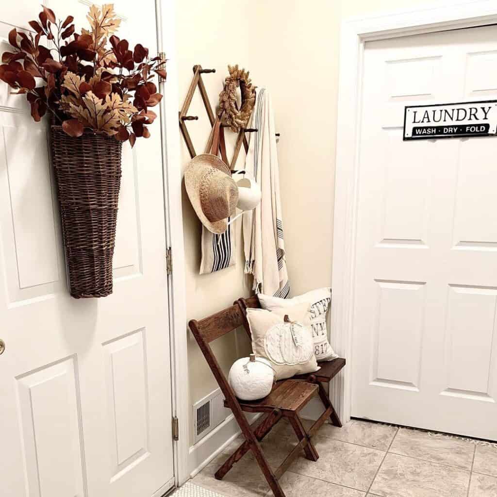 White Hallway with Wicker Wall Hanging and Dried Leaves