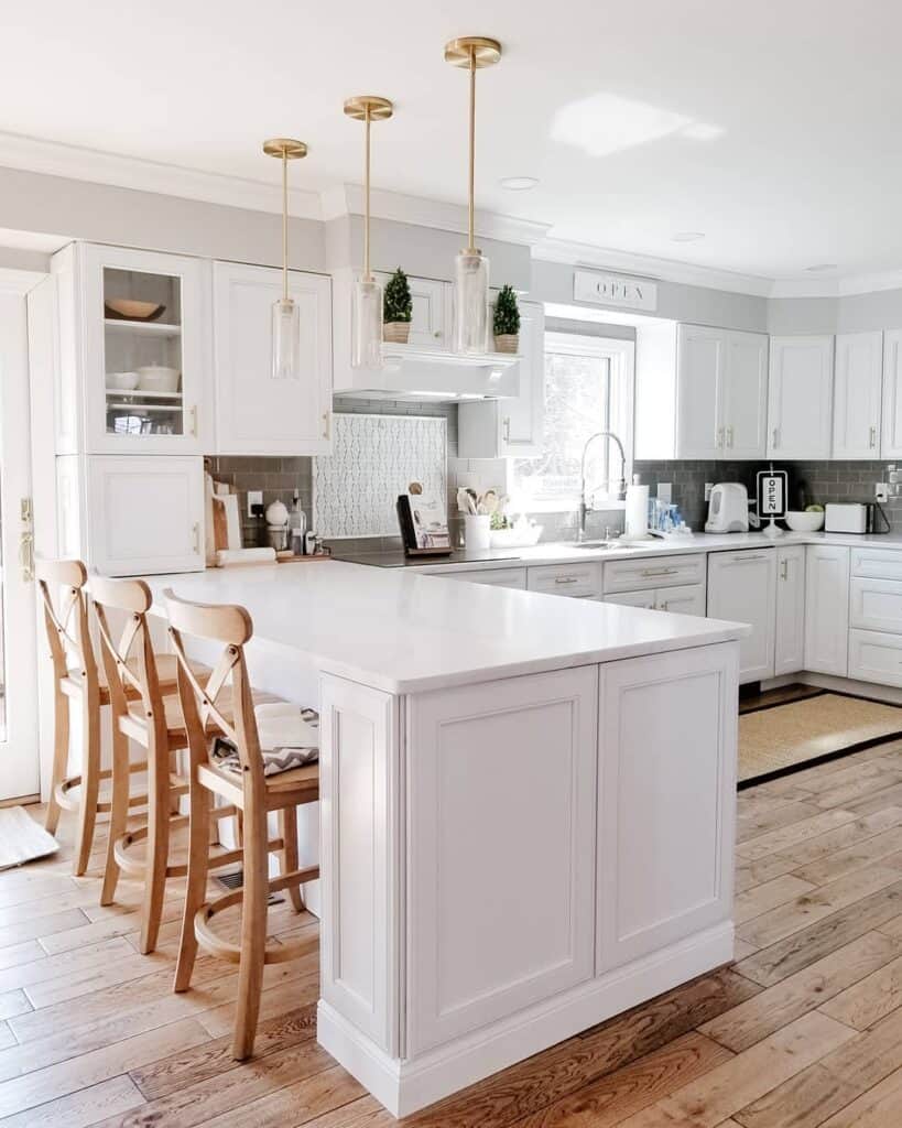 White Kitchen Peninsula with Wood Bar Stools