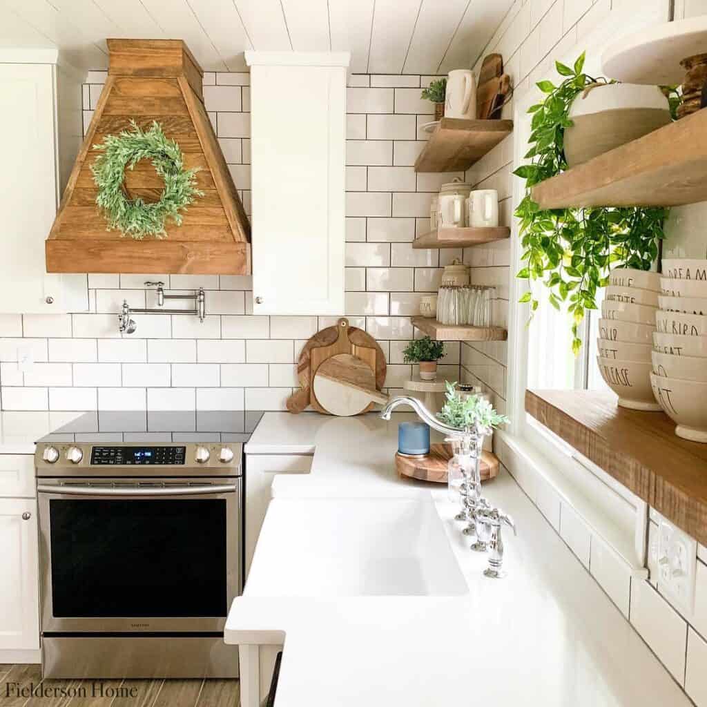 White Kitchen with Wooden Range Hood and Shelving