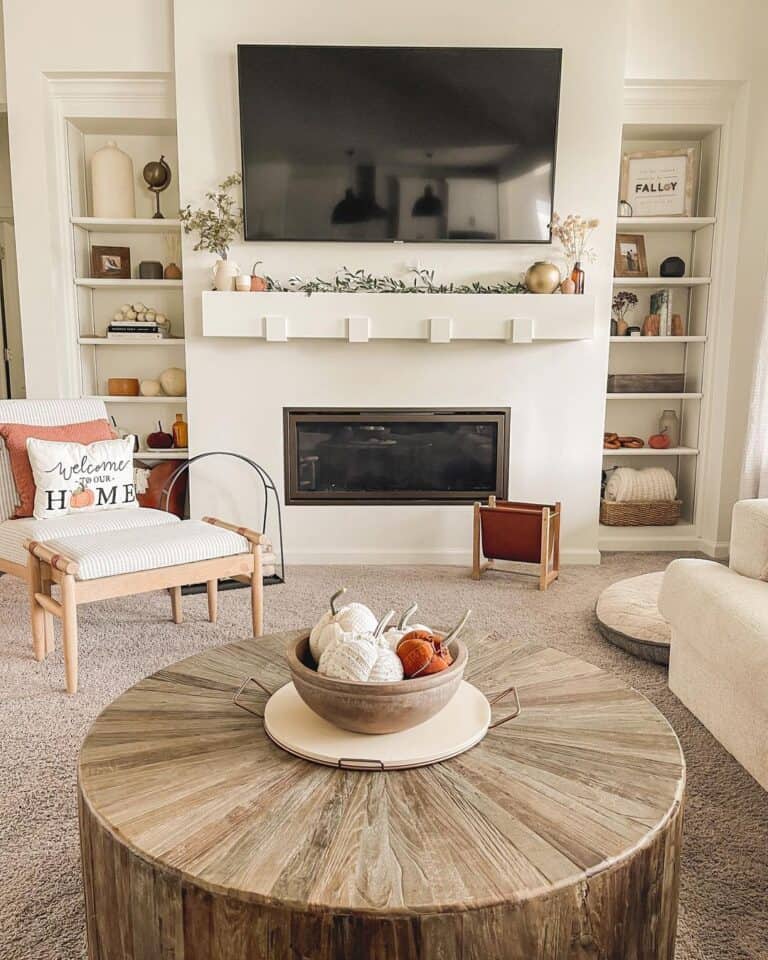 White Living Room with Drum Coffee Table and Fall Decor