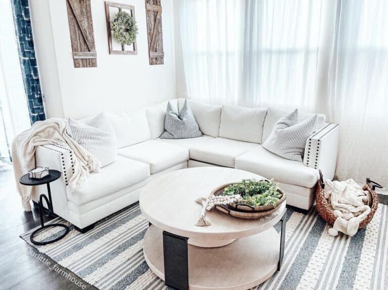 White Living Room with Round Stone Coffee Table