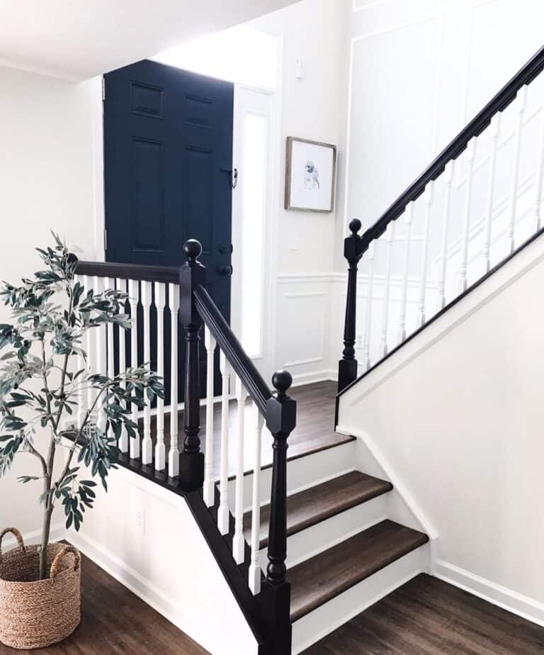 White Paneled Walls and a Dark Hardwood Floor