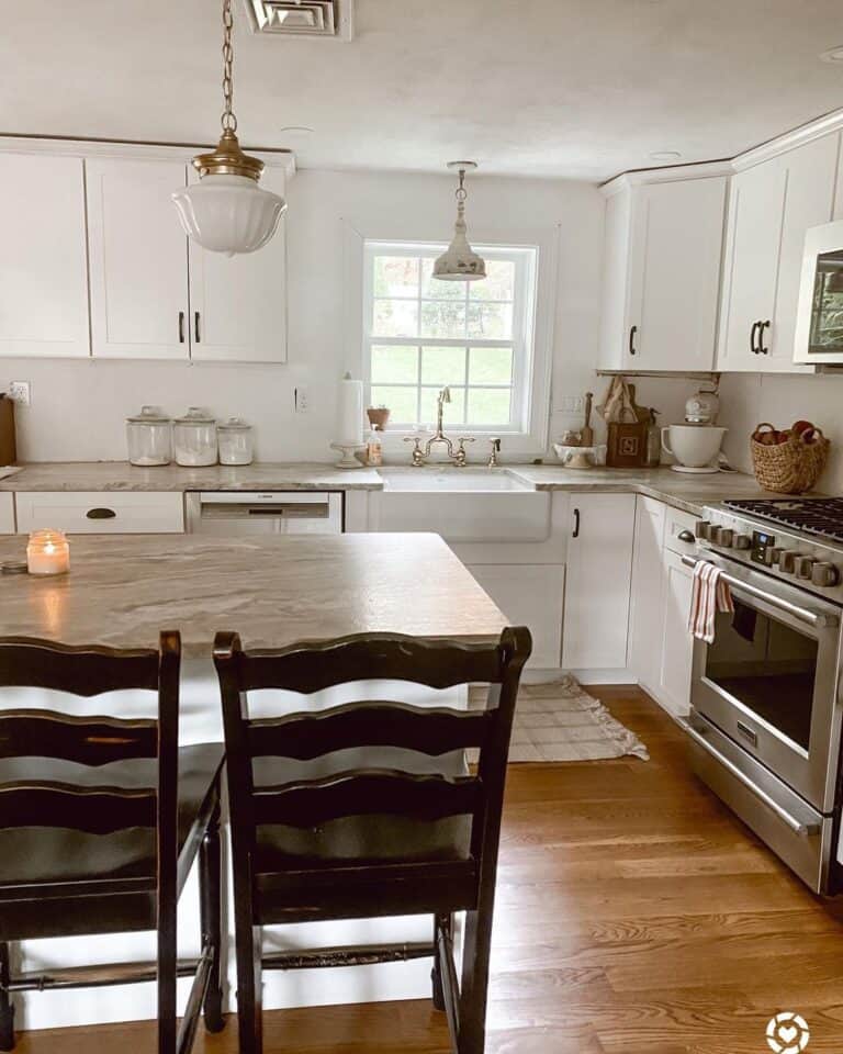 White Pendant Light Over a Brown Marbled Countertop