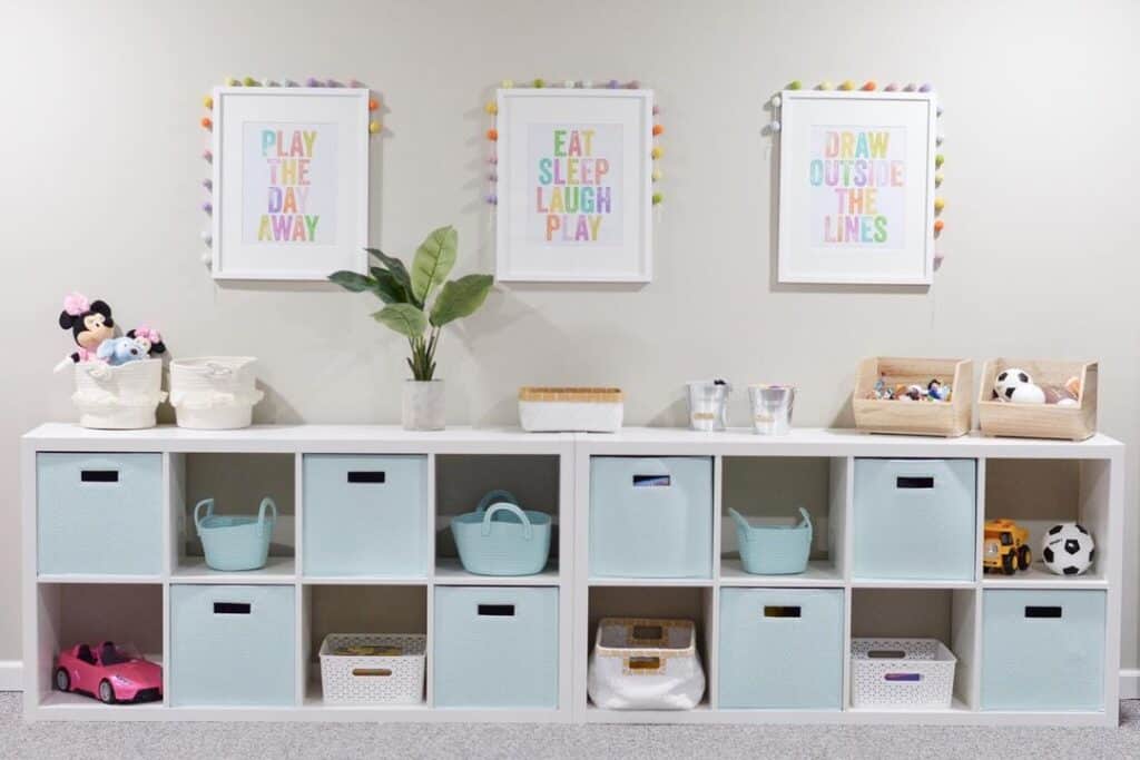 White Playroom Storage Cubes Under Colorful Signs