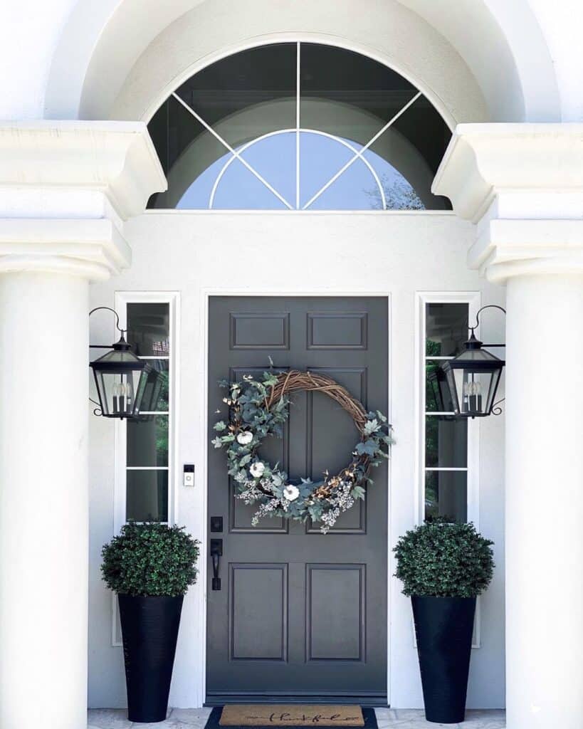White Pumpkins on a Black Farmhouse Front Door With Sidelights