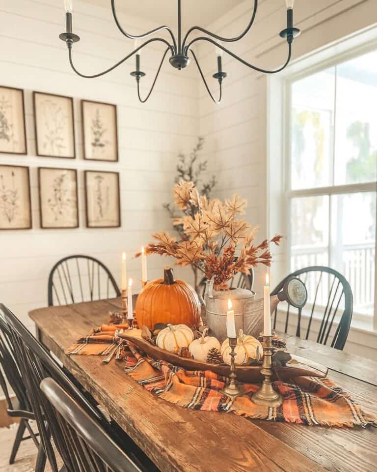 White Shiplap Dining Room with Orange Pumpkin and Watering Can Centerpiece